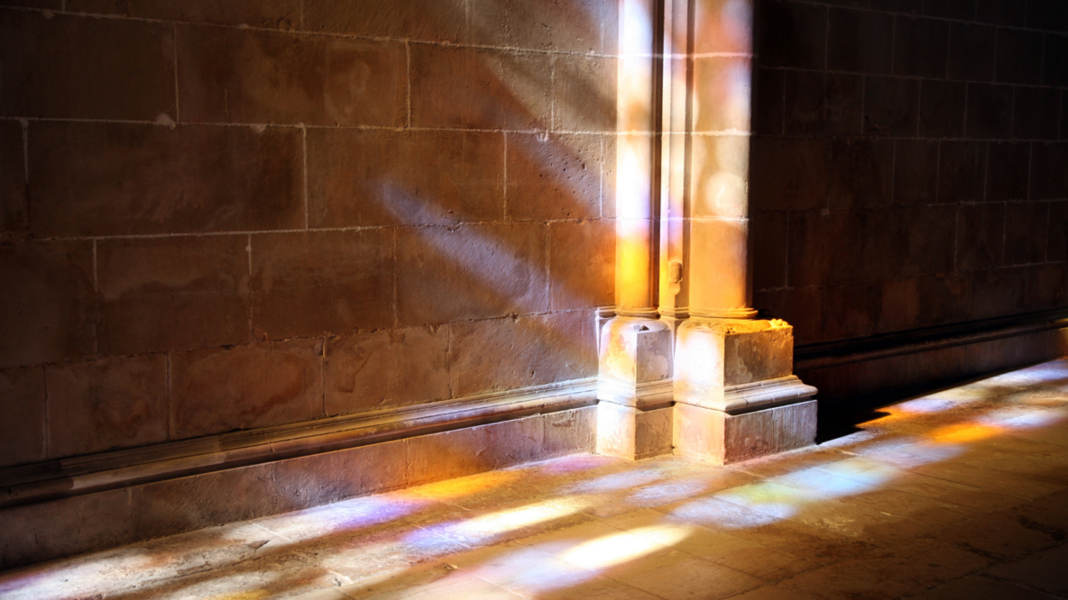Light reflecting on cathedral stone wall